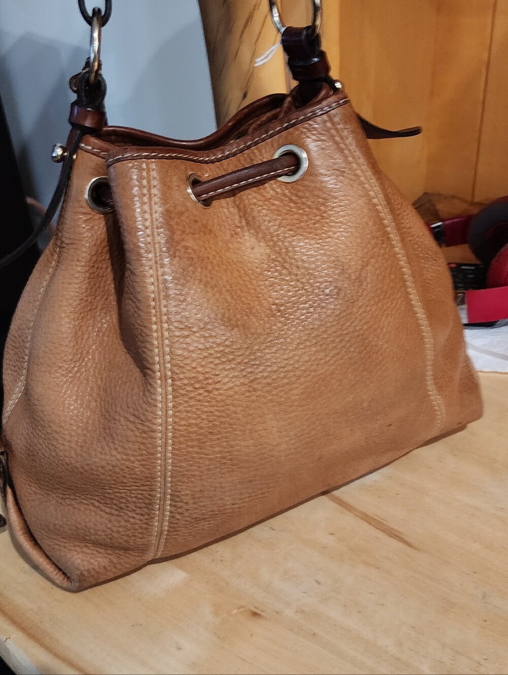 Dooney & Bourke Pebble Leather Drawstring Bucket Bag in Cognac - Picture 3 of 7